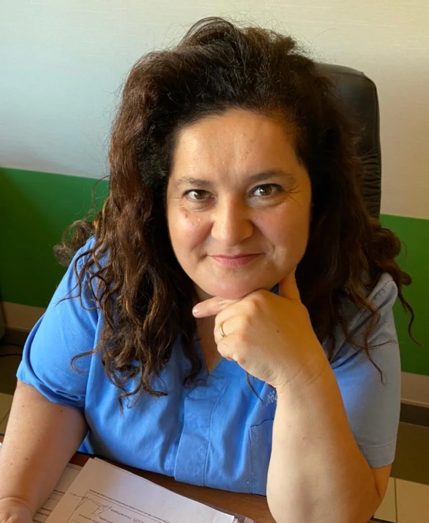 a woman with her hand on her chin