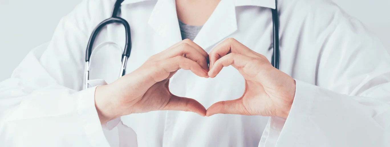 a close-up of a doctor holding a hand