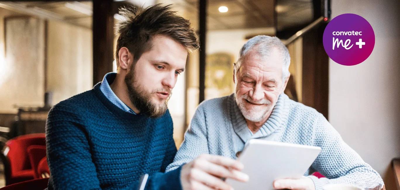 a man looking at a tablet